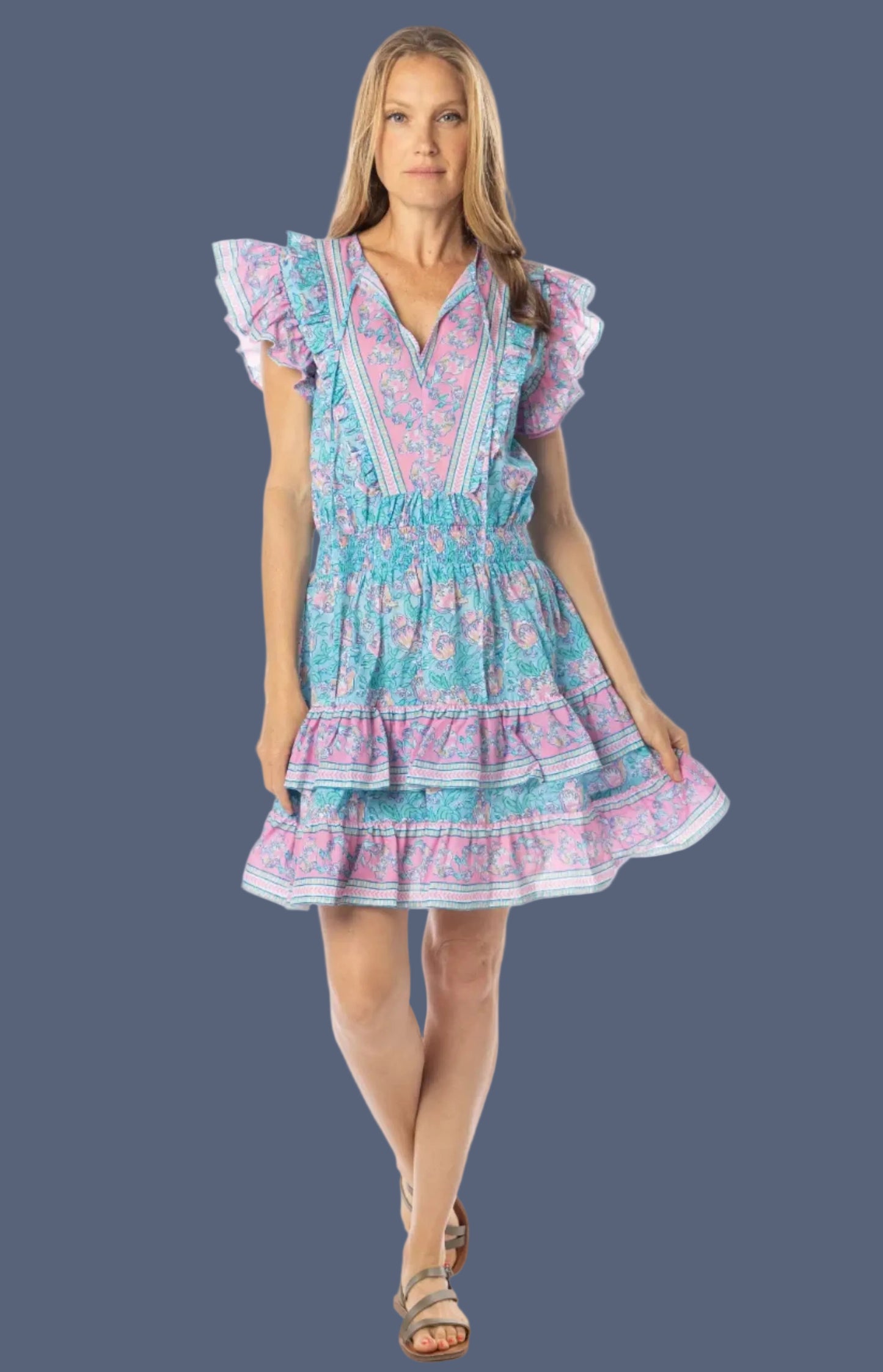 Woman wearing a colorful dress on a white background