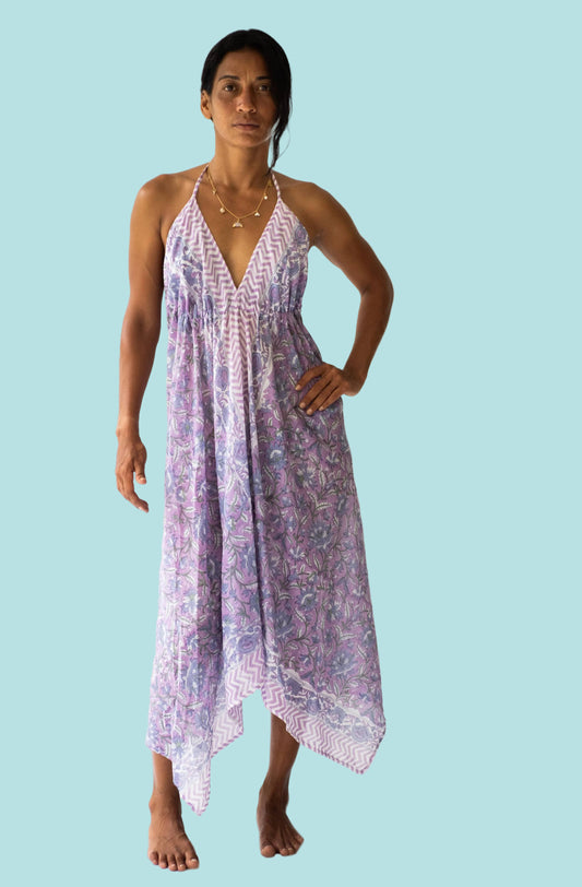 Woman wearing a patterned dress on a white background