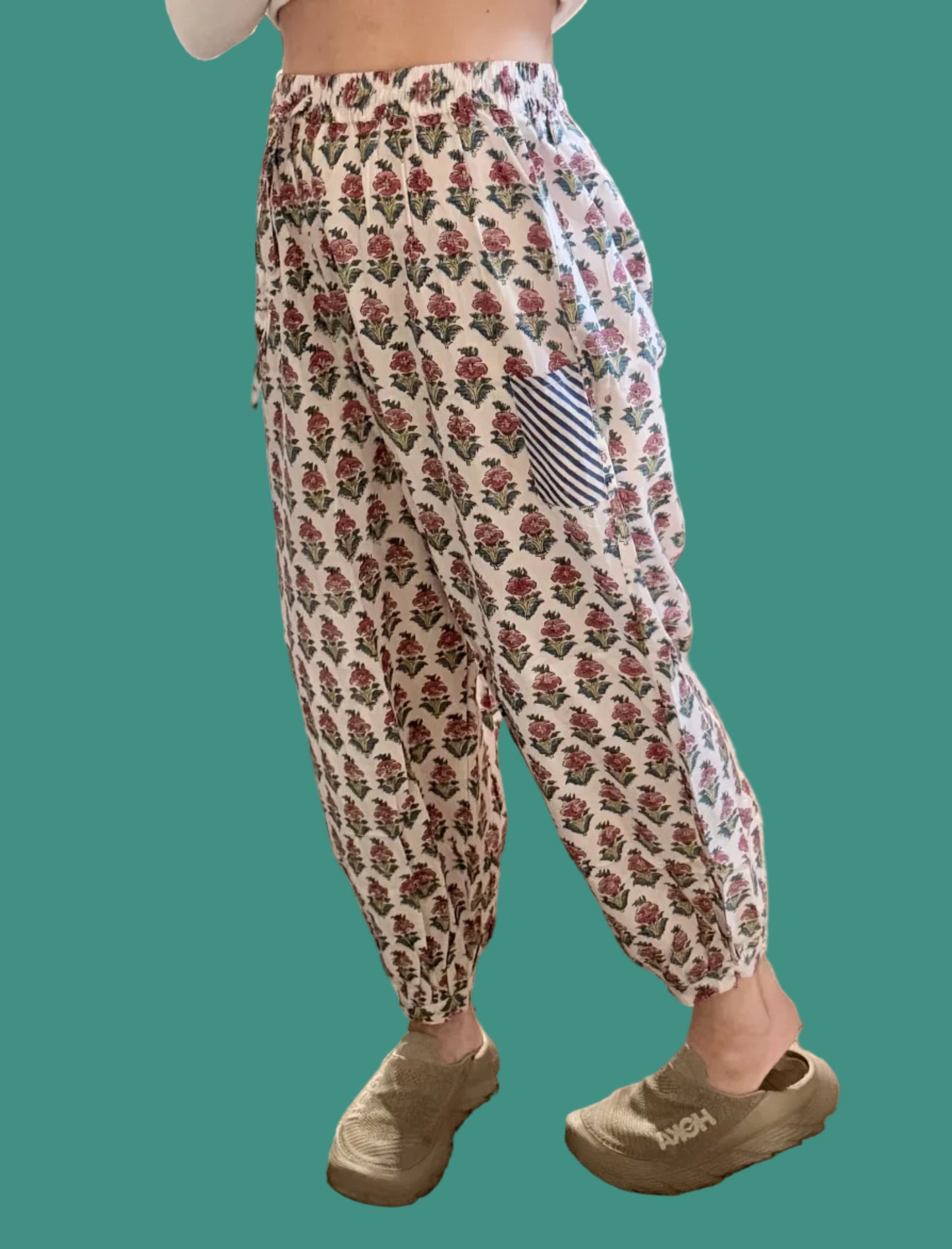 Person wearing patterned pants in a store setting