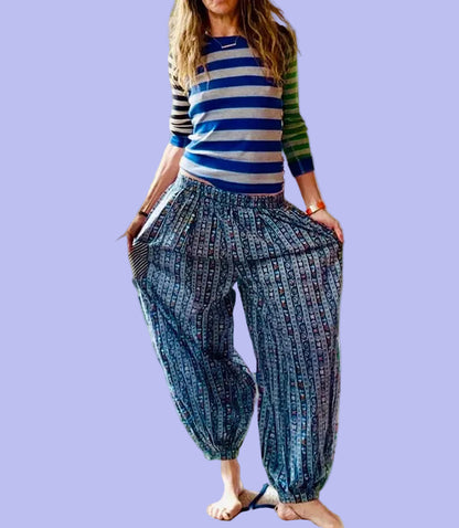 petra wearing a striped shirt and patterned balloon pants 